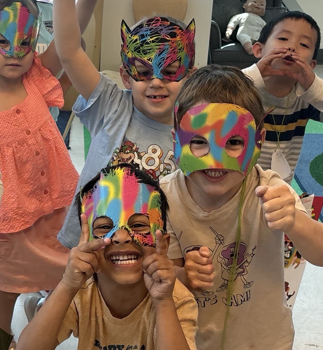 Campers wearing hand-painted masks at Camp Bulldog